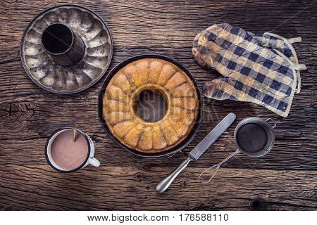 Marble cake.Easter Cake. Marble cake cup of coffee powder sugar and kitchen vintage utensil.