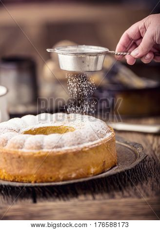 Marble cake.Easter Cake. Marble cake cup of coffee powder sugar and kitchen vintage utensil.
