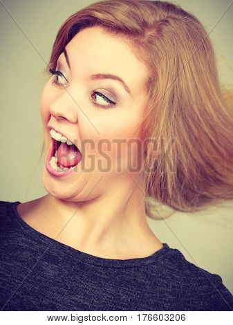 Closeup Woman Face Making Crazy Funny Expression