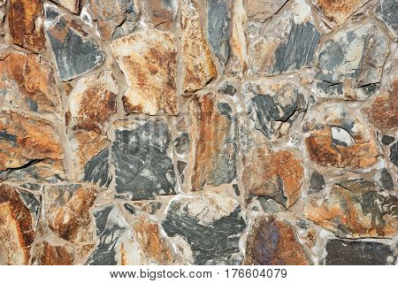 Colored natural stone wall background, wll texture