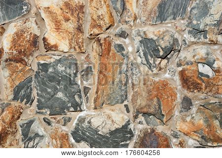 Colored natural stone wall background, wll texture
