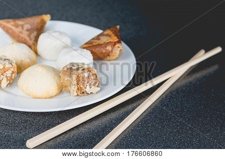Delicious Assortment Of Homemade Asian Pastries. Samosas With A Rose Flower And Banana Balls