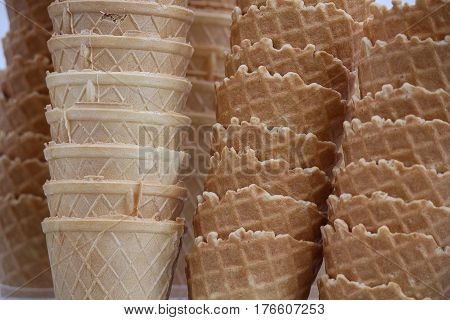 Group of yellow waffle cones close-up. Dessert