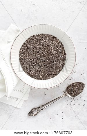 Chia seeds on white baclground directly above copy space