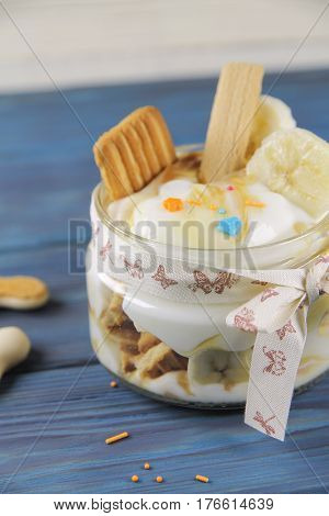 Delicious curd dessert with banana and caramel