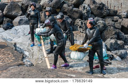 JEJU, SOUTH KOREA - MAR 27: Haenyo divers perform a folk dance at a festival on traditional Korean culture in Jeju, South Korea on Mar 27, 2011