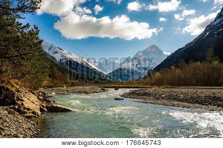 The River Flows Between The Mountains