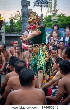 Bali Indonesia - March 03 2013: Kecak dance is a traditional ritual of Bali Indonesia.This dance is being shown at Uluwatu Temple.Blurred appearance of flowing dance.