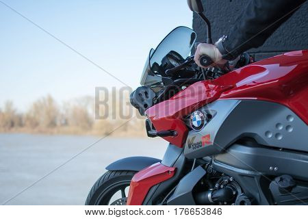 Senta Serbia: March 4th 2017. Closeup of beautiful BMW K1300R motorcycle photographed outdoor on a dock in Senta besides beautiful painted wall under the bridge.