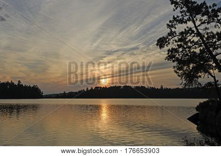 Sun and Silhouettes in Canoe Country on Saganaga Lake in Quetico Provincial Park in Ontario
