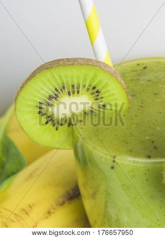 Fresh and healthy green smoothie with spinach,banana, kiwi and apple. Selective focus