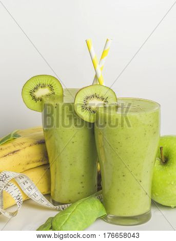 Fresh and healthy green smoothie with spinach,banana, kiwi and apple