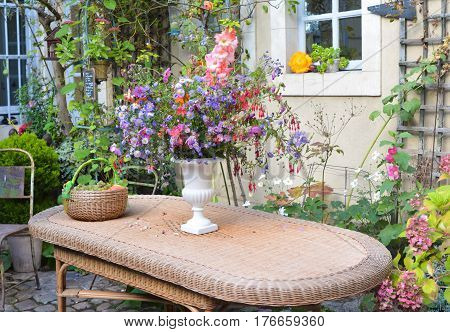 bouquet of summer flowers in a white vase