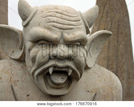Angry Gargoyle with Horns and Pointy Ears