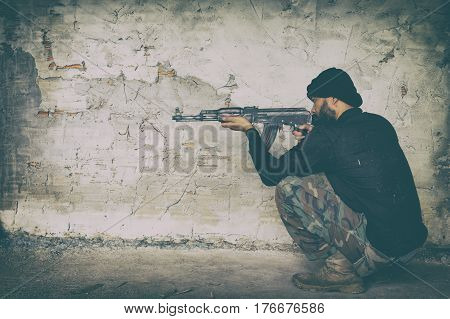 Terrorist In Black Uniform And Mask With Kalashnikov
