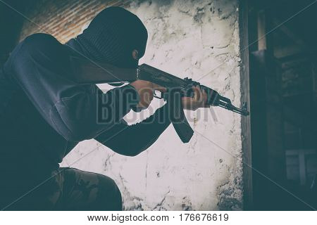 Terrorist In Black Uniform And Mask With Kalashnikov