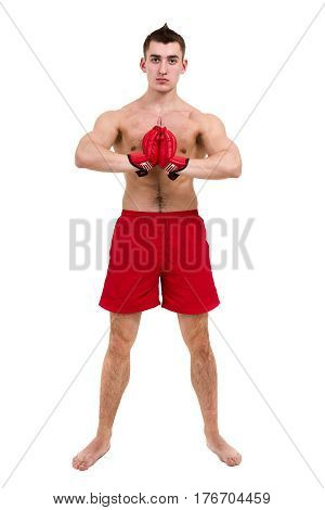 Full length portrait of young male boxer showing some movements against isolated white background with copyspace