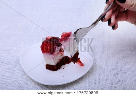 Slice of handmade cherry pie on a plate and classic espresso coffee in white background.