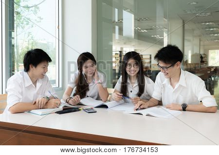 Group of Asian students in uniform studying together at classroom. Asian students looking happy to study. Education Student People concept.
