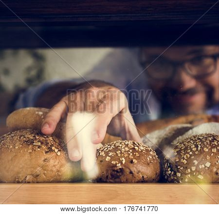 Man with pastry homemade at bakehouse