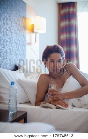 Young Happy Black Woman Lying In A Bed.