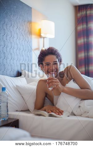 Young Happy Black Woman Lying In A Bed.