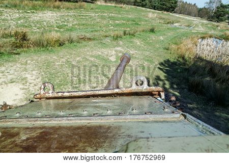Battle tank in the moor of a forest