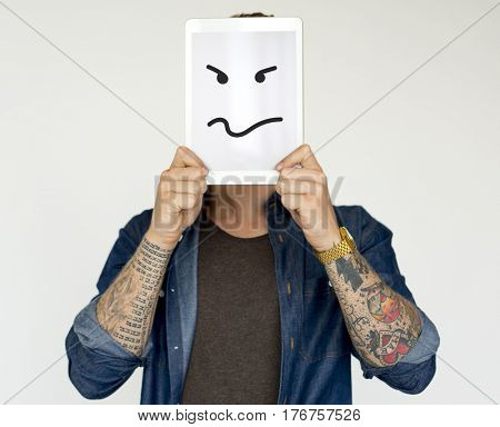 Man standing and holding digital device