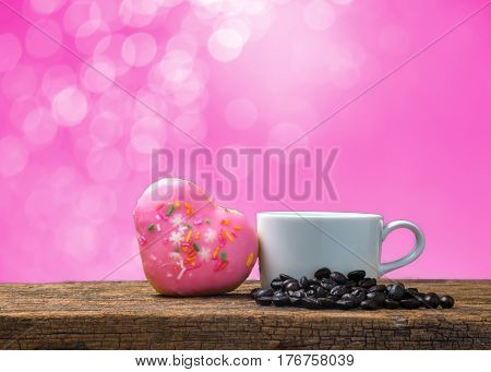 Pink donut with heart and a glass on a bokeh Backgrounds color pink