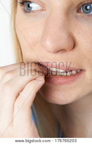 Close Up Of Nervous Woman Biting Nails