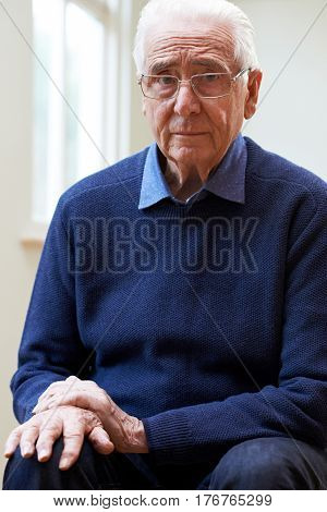 Portrait Of Senior Man Suffering With Parkinsons Diesease