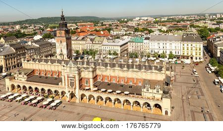 POLAND, KRAKOW- JULY 03: Arched palace in the old city of Krakow, different facades, caffee nearby and tower, aerial in Krakow Poland on July 03, 2015