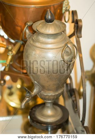 An ancient copper vessel for making tea. Brewing tea in Russia.