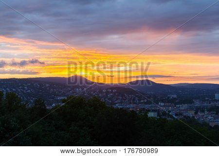 Evening panorama of Budapes from Gellert Hill with a beautiful sunset sky