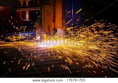 Metal sparks. Industrial laser and plasma cutting of sheet steel