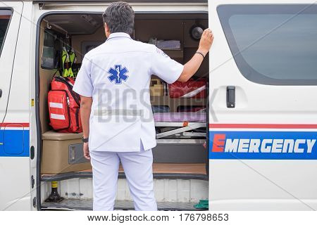 Male Nurse Standing Beside Ambulance Prepare For Helping People