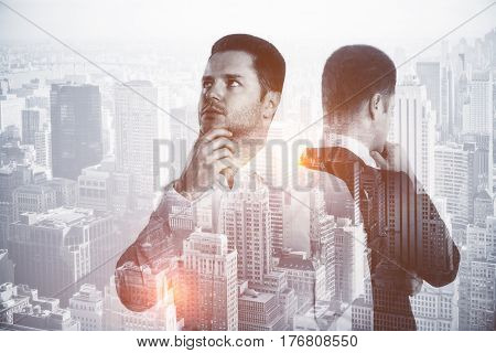 Thoughtful businessman with his reflection on city background. Future concept. Double exposure