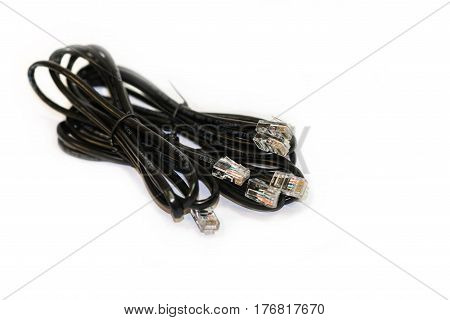 Blach ethernet cable on a white background. Network equipment accessories