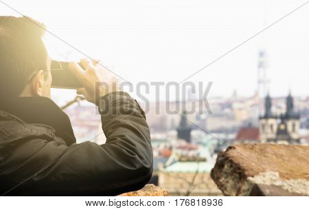 a tourist in Europe taking photo tourist with a back bag travelling around Europe