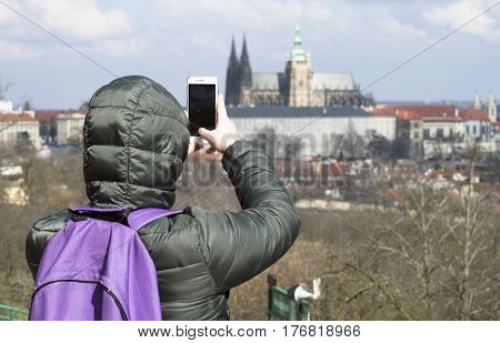 a tourist in Europe taking photo tourist with a back bag travelling around Europe