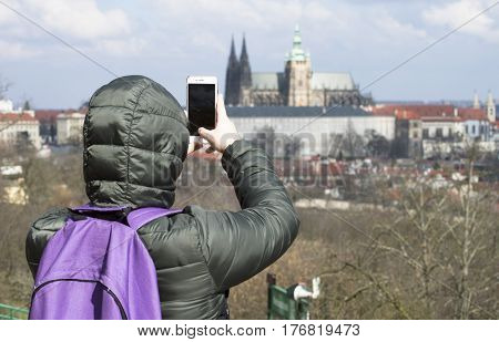 a tourist in Europe taking photo tourist with a back bag travelling around Europe