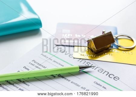 booking travel concept with insurance form and credit cards on white table background