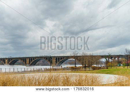 Washington DC Key Bridge and reflection over Potomac River Georgetown Waterfront Park