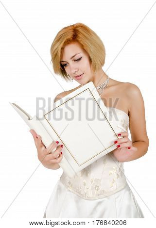 Happy girl in a white evening dress and necklace. Bare shoulders. Butch. Isolated on white background