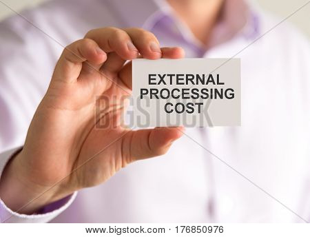 Businessman Holding A Card With External Processing Cost Message