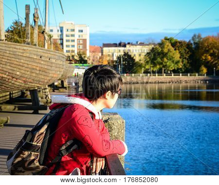 Tourist Looking At Lake Scenery In Vyborg, Russia