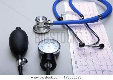 RX prescription, Red heart, asorted pils and a stethoscope on white background.