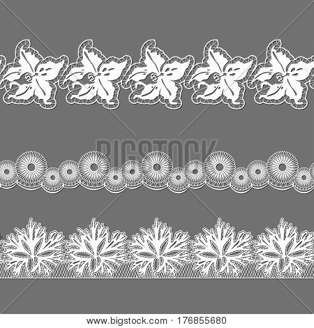 set of ribbons embroidered cutwork on a gray background