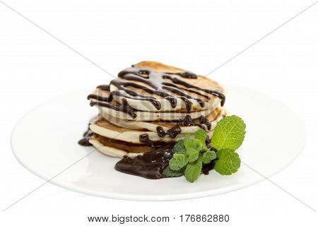 A pancake is a flat cake often thin and round prepared from a starch-based batter that may also contain eggs milk and butter and cooked on a hot surface such as a griddle or frying pan often with oil or butter.