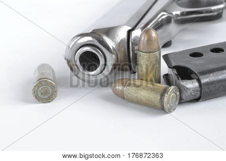 Pistol and ammunition on the white background.